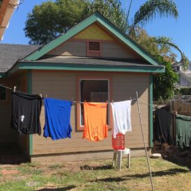 Nice environmentally responsible way to dry clothes, but — doesn't this guy wear pants?